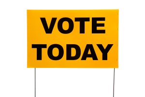 Yellow Yard Sign With "vote Today" On It